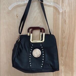 Black and Gold Shoulder Bag with Structured Design